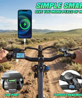 Rider on Go To 26 Inch Commuter Electric Bike with 720W peak motor showing handlebar controls and USB port on dirt path
