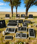 Weatherproof Custom Memorial Plaques In Black Granite With Marble Base in natural setting with trees and grassland.