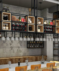 Industrial Iron And Raw Wood Wall Mounted Wine Rack, Heavy Duty Hanging Bottle Holder with organized glassware display.