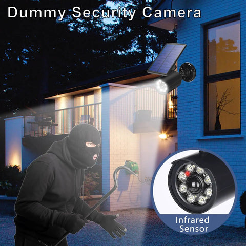 Dummy security camera with infrared sensor mounted on house, simulating real surveillance to deter intruders at night.
