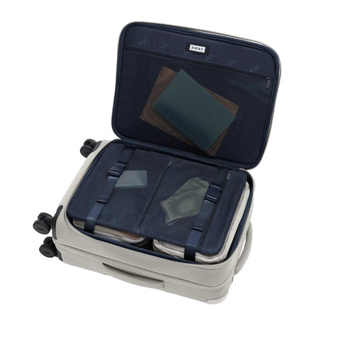 Open Softside Bigger Carry On Luggage 23 Inch Expandable With Spinner Wheels Built Tough Nylon TSA Accepted Cloud Gray interior view.