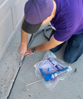 Person applying Elastic Slab Concrete Crack Repair Sealant Gray 10.5 Ounce Cartridge Pack Of Twelve to concrete driveway crack