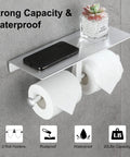 Anti Rust Aluminum Double Roll Toilet Paper Holder with Built In Shelf for Phone Keys and Essentials Self Adhesive or Screw Mount No Drill Bathroom Organizer in Silver Finish, installed on wall with phone and plant on shelf.