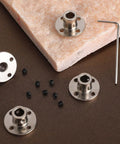 Four stainless steel 6mm rigid flange shaft couplers with set screws and hex key