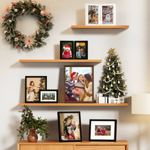 Double 4x6 Picture Frame Vertical From Engineered Wood With Plexiglass Bifold Photo Frame For Tabletop Display Holds Two 4x6 Photos In A Dope Black Finish That Fits Any Desk Or Shelf displayed on a wooden shelf with holiday decorations