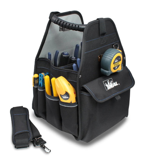 Heavy Duty Professional Tool Carrier With Thirty Four Pocket Layout Removable Drill Bit Sleeve Tape Measure Holder Sturdy Molded Carry Handles built tough for tradesmen, showing pockets with tools.