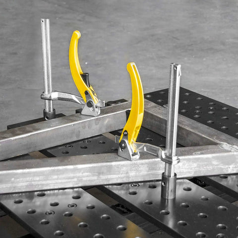 Inserta Clamp With Five Eighths Inch Insert And Ratchet Handle, Four Inch Throat Depth, Workhorse Locking Clamp For Tight Spaces, 400 Pound Clamping Pressure, Rail Size Twenty Five Thirty Seconds By Three Eighths, Model UERN5200 clamping steel bars on a fixture plate