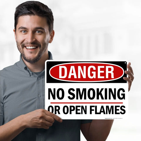 Man holding a Straight Up Danger No Smoking Or Open Flames Sign 10X14 Inches.040 Rust Free Aluminum Fire Safety Warning Plaque.
