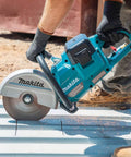 Straight Up Beast Mode 9 Inch Cordless Power Cutter With Brushless Motor cutting through concrete, sparks flying during use.