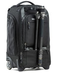 Walker Pro Rolling Camera Backpack with attached tripod, showing smooth rolling wheels, black rugged material exterior, and front pockets.