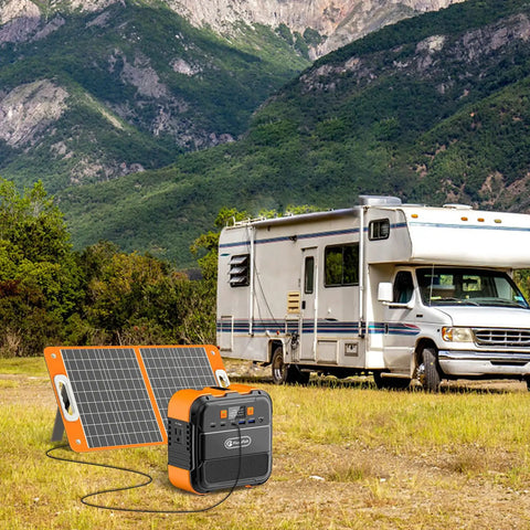 Ultra Portable 98Wh Solar Generator Kit With 60W Foldable Panel, 120W Power Station, next to RV in mountain landscape