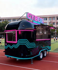 Commercial Grade Coffee Trailer And Mobile Hot Dog Cart Featuring Chef Ready Full Kitchen Setup With Plug And Play Wiring To Help You Crush Sales At Street Events, black exterior, neon design, mobile concession unit.