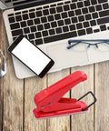 One Quarter Inch Hole Puncher With 20 Sheets Capacity Ergonomic Grip Easy Handheld Metal Paper Punch on wooden desk with laptop