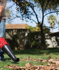 Person using High Performance Blower Attachment With Concentrator For Attachment Capable Trimmers Polesaws And Powerheads Delivers Up To 500 CFM Airflow