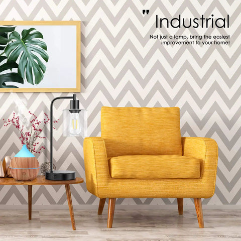 Cool Industrial Seeded Glass Table Lamps Set Of 2 With Touch Control next to a yellow armchair in a stylish living room.
