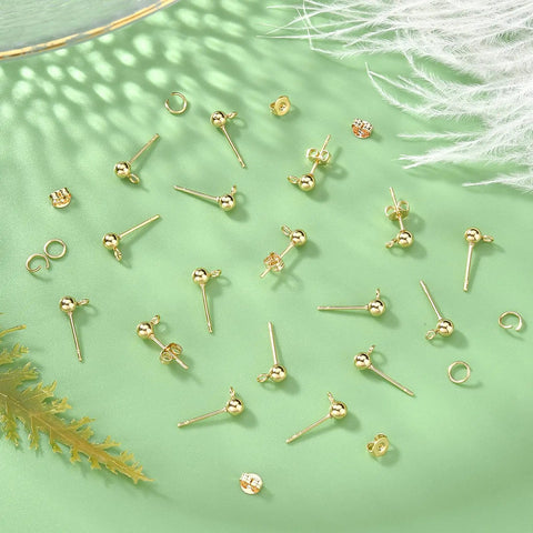 18K Gold Plated Ball Post Earring Studs With Loop Kit For DIY Earrings Making, 300 Pieces Including 100 Loop Posts, 100 Stainless Steel Open Jump Rings, And 100 Ear Nuts For Jewelry Crafting, gold posts and jump rings on green background