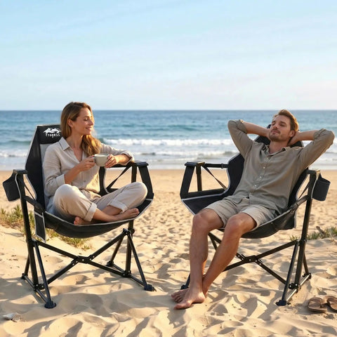 Couple relaxing on beach in ultra comfy portable hammock camping chair with adjustable backrest, Stargazer Black