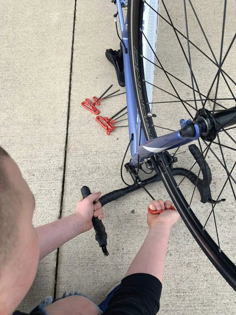 Person using Cushion Grip Hex T Key Allen Wrench Set 10 Piece SAE Inch Sizes 3 32 to 3 8 6 Inch Length Pro Grade on bicycle wheel