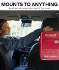 SurviveX red car first aid kit hanging from headrest with US flag patch