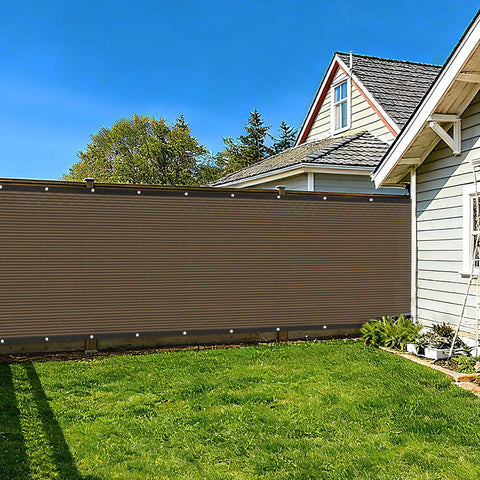 6 Foot By 50 Foot Privacy Fence Screen 180 GSM Heavy Duty Shade Net With Reinforced Bindings And Grommets in a backyard setting