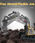 11 Channel Remote Control Excavator Toy For Boys With Lights And Dual Batteries Included showing flexible arm in rocky terrain.