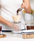 Clear Coffee Scoop For POP Storage Containers, 2 Tbsp 30 mL Capacity, scooping ground coffee into a dripper