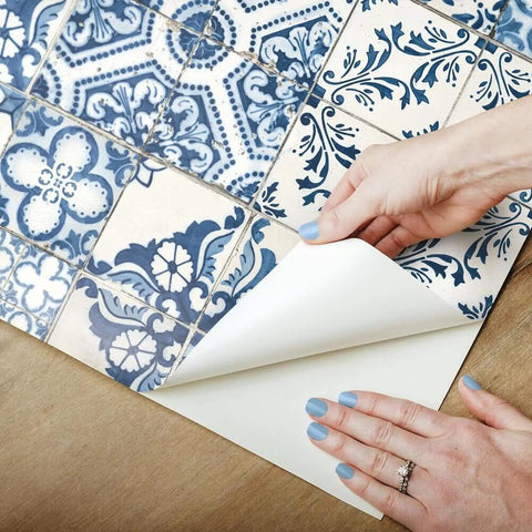 Hands applying Blue Mediterranean Tile Peel And Stick Wallpaper No Mess No Water No Fuss Removable And Repositionable 20.5x16.5