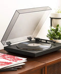 Sony PS-LX310BT Belt Drive Turntable Fully Automatic Wireless Vinyl Record Player with Bluetooth Connectivity USB Output Two Speeds 33 And 45 RPM Easy One Step Operation Built In Phono Preamp For High Quality Audio Playback on wooden table with vinyl records.