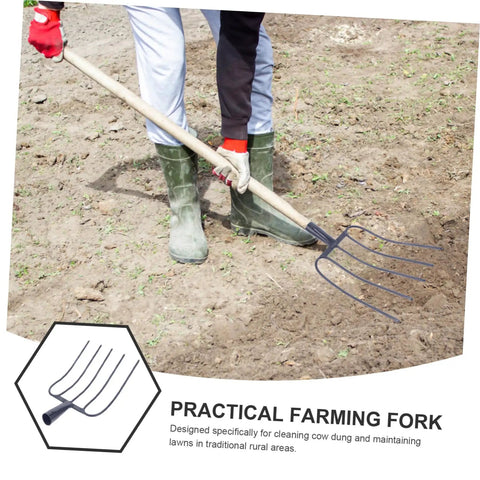 Person using heavy duty handheld manure fork for garden and lawn cleanup, iron farm tool for outdoor use on soil.
