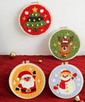 Punch Needle Kit For Beginners With Wooden Handle Tools featuring Christmas-themed embroidery hoops with Santa and reindeer designs.