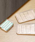 Clear Plastic Shim Wedges 8 Pack for Leveling Tables and Furniture, displayed on wooden surface, close-up view of wedges.