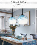 Blue Swirl Marble Art Glass Pendant Light With 12 Inch Shade Adjustable Cord Ceiling Fixture in dining room setting.