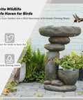 Solar Fountain For Bird Bath And Planter, freestanding rock waterfall with LED lights in garden setting