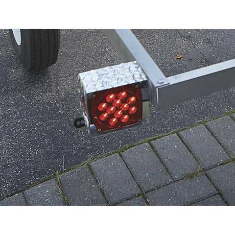 Aluminum 5x8 Utility Trailer Kit With Rustproof Frame 1715 Lb Payload shows corner light assembly and wheel on pavement.
