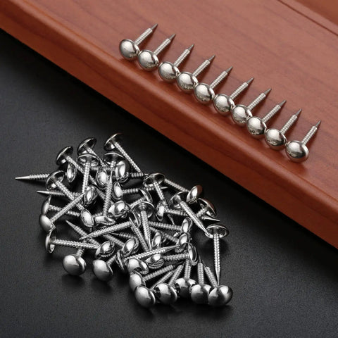 Kick Your Home Decor Up A Notch With These Legit Tough Vintage Silver Upholstery Nails 100 Piece Zinc Alloy Furniture Tacks on a black background.