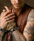 Dope Three Piece Leather Punk Set Featuring Spiked Gothic Choker And Dual Studded Wristbands For Savage Street Style Rock Edge Heavy Metal Fits Perfectly, showing dual studded wristbands on tattooed arms.