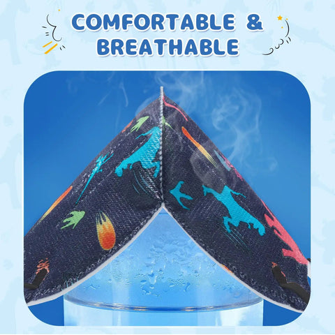 Close-up of dinosaur-patterned Kid Sized KN95 Face Masks Disposable 5 Layer Breathable Small Size demonstrating breathability.