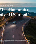 Top Shelf High Mileage Full Synthetic Motor Oil In 0W-20 Viscosity With 5 Quart Container on a winding road near mountains.