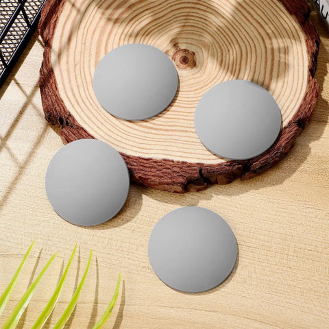 Gray Silicone Door Handle Buffer Guards 4 Pack Self Adhesive Wall Protectors on a wooden surface