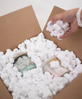 Heavy Duty White Packing Peanuts For Zero Stress Shipping Anti Static S Curve Half Cubic Foot Void Fill protecting fragile candles in box.