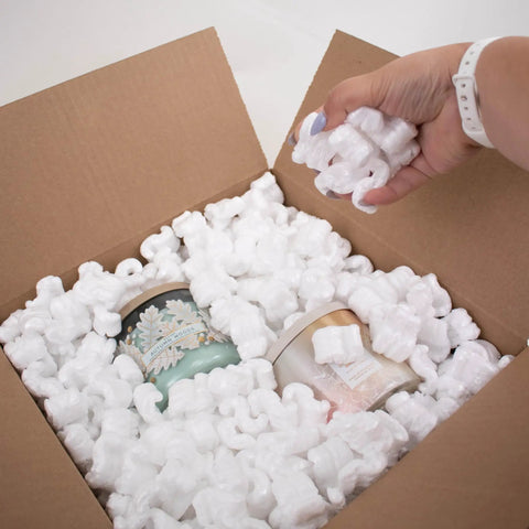 Heavy Duty White Packing Peanuts For Zero Stress Shipping Anti Static S Curve Half Cubic Foot Void Fill protecting fragile candles in box.
