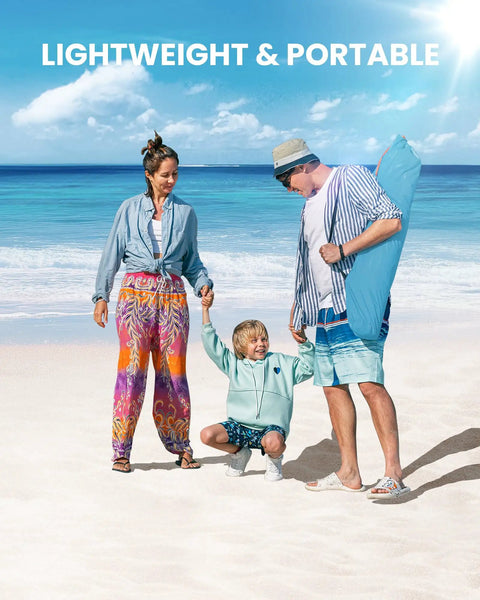 Family on the beach with dad carrying a Pop Up Beach Tent For 3 To 4 People With Sandbags, Easy One Person Setup, Portable Sun Shade Canopy