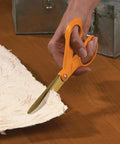 Person using Titanium Coated Workhorse Shop Shears For All Purpose Yard And Garden Cutting, 9 inch serrated blades on material
