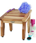 Teak Shower Stool For Shaving, 12 Inch Compact Foot Stool with shower accessories on top, showing nonslip design.