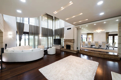 Modern living room with Kickin Recessed Downlight Kit For Easy Install 5 To 6 Inches, hardwood floor, white rug, and sofa.
