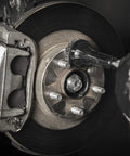 Wheel Hub and Rotor Polishing Kit With Tough Nylon Pads For Rust Removal And Built Up Grime on brake rotor lug studs in use