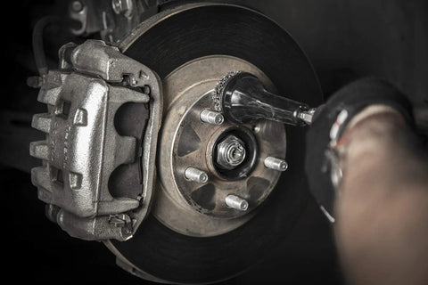 Wheel Hub and Rotor Polishing Kit With Tough Nylon Pads For Rust Removal And Built Up Grime on brake rotor lug studs in use