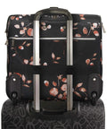 Back view of Valentina Underseat Wheeled Carry On Luggage With Floral Branch Design showing push button handle and inline skate wheels.