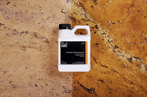 Real Deal Stone Enhancer And Penetrating Sealer That Levels Up Marble And Granite Water Based Formula in a 1 pint bottle on stone surface.