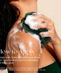 Woman using African Net Sponge Exfoliating Bath Loofah for deep cleansing, showing foaming action on shoulder